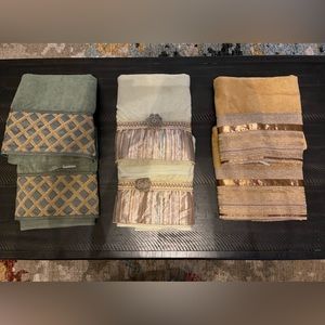 Three sets of a avanti decorative towels.